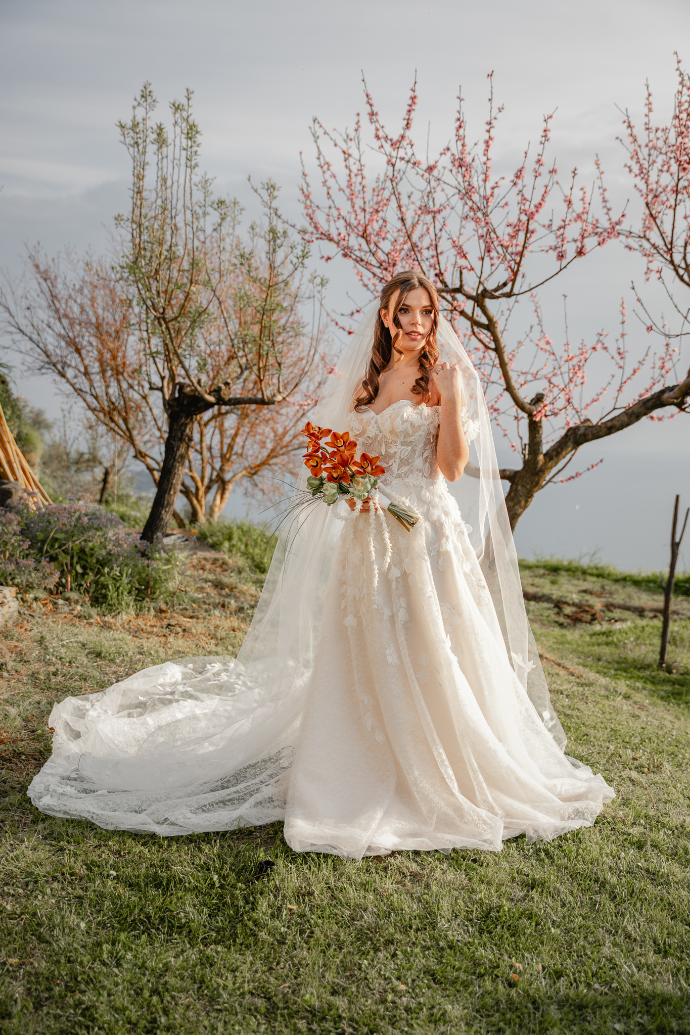 Christian Bride portrait during Christian destination wedding in Italy, outdoor ceremony with wedding dress and bouquet