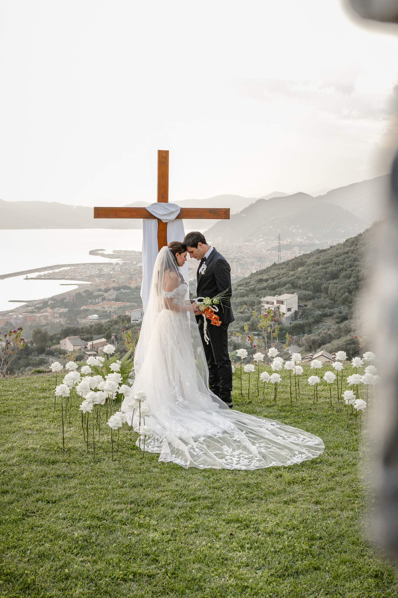 Christian wedding ceremony in Italy with bride and groom, destination Christian wedding at sea view wedding location