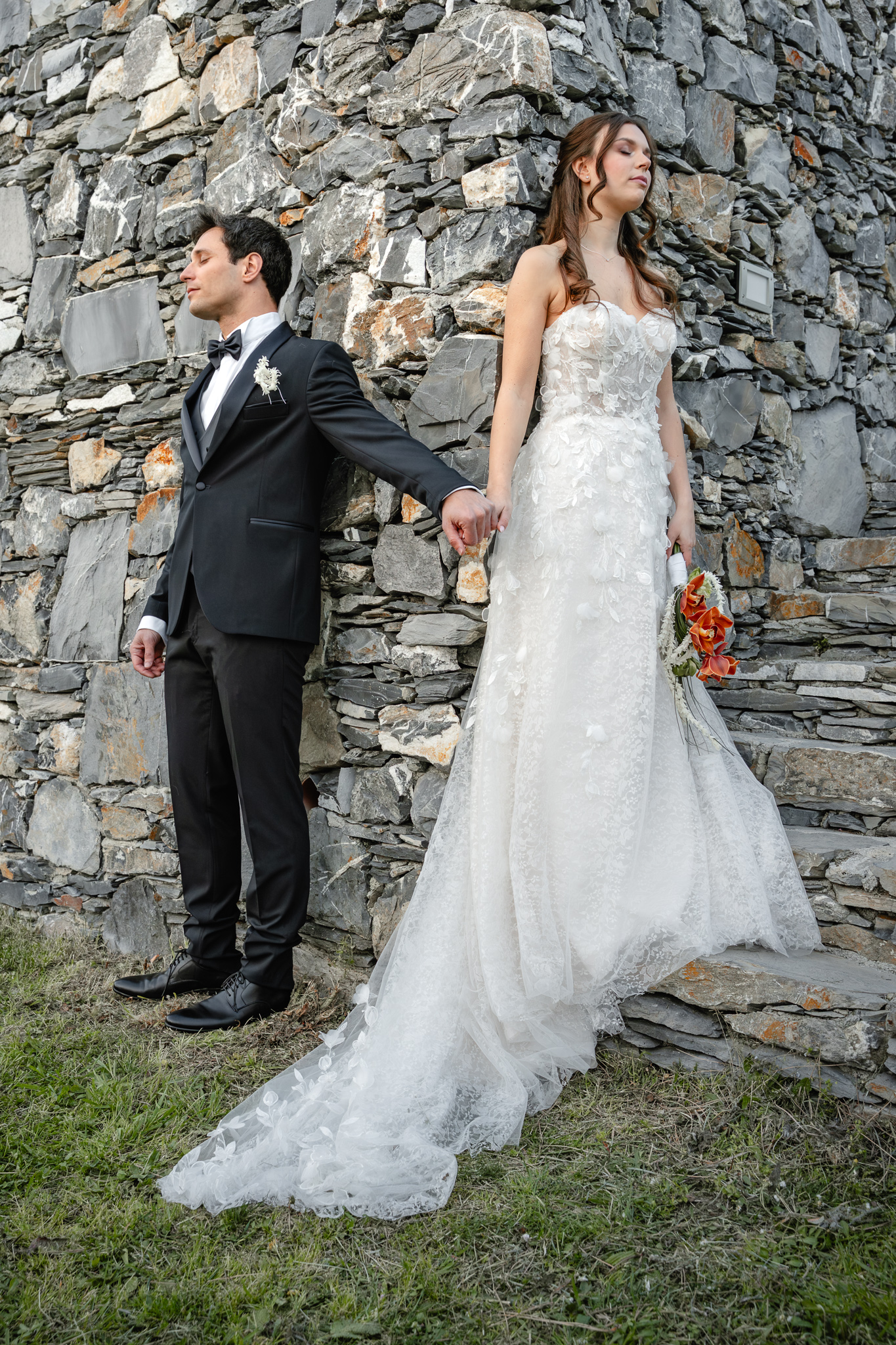 Bride and groom praying together during a Christian destination wedding in Italy, intimate faith-based wedding moment