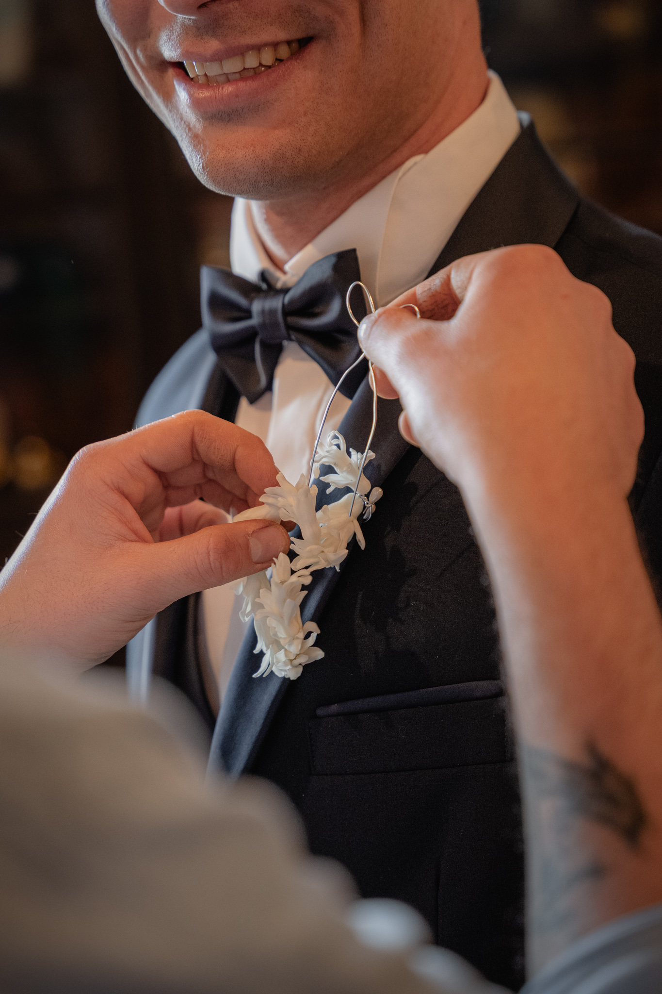 Boutonniere detail on groom suit during Christian destination wedding in Italy, elegant wedding styling