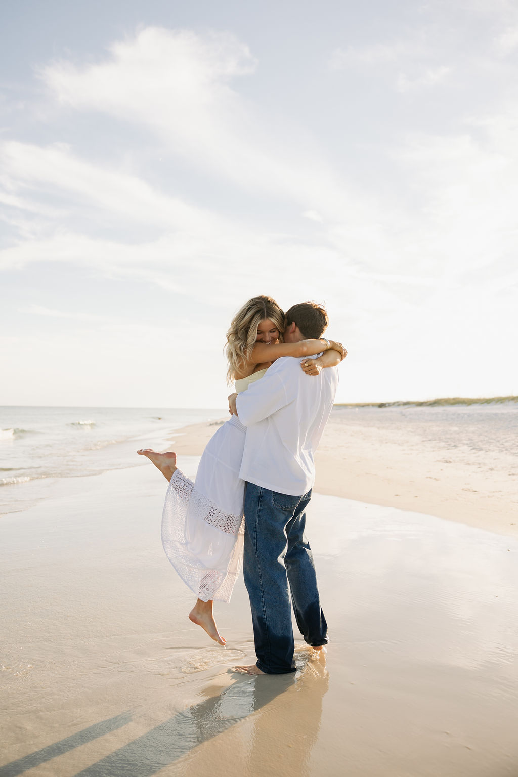 A Christian couple just celebrating their engagement on the beach. Photo by Spencer Lauren Christian Wedding Photographer