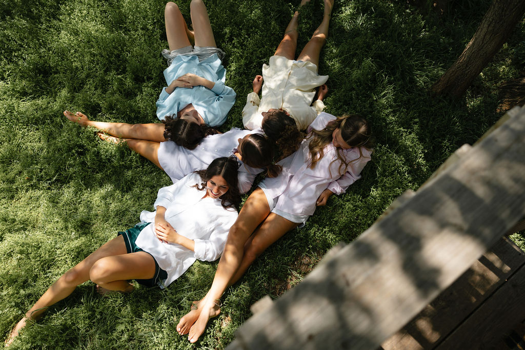 Christian bride prays with bridesmaids peacefully before the Christian Wedding Ceremony. Photo by Spencer Lauren