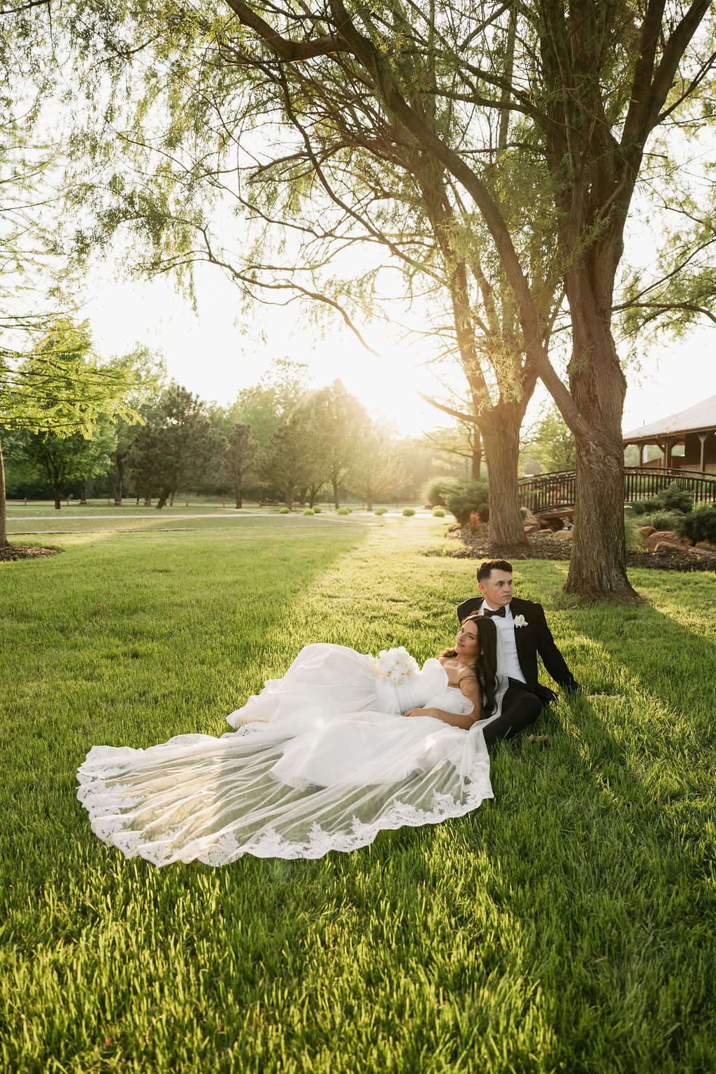 Christian bride and groom captured by Spencer Lauren taking photos after the Christian wedding ceremony