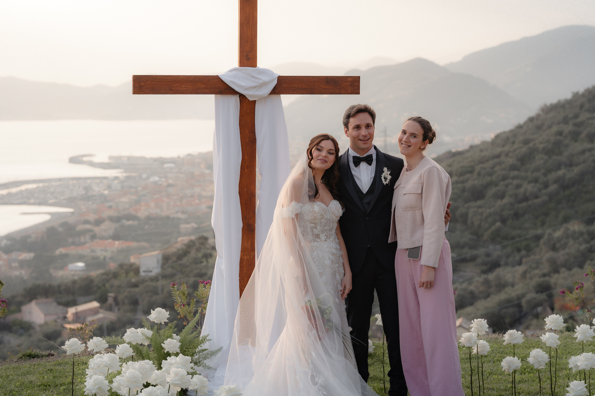 Christian wedding planner with Christian bride and groom smiling Christian ceremony in Italy